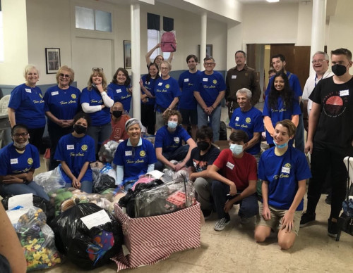 San Pedro Rotary Club and Plant District assembling backpacks 
